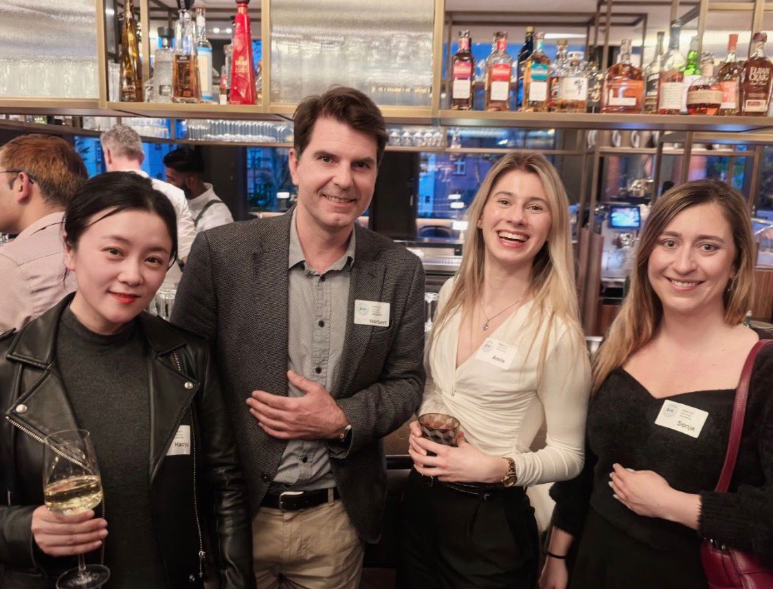 Four FIAA guests smiling at the KaSa Bar